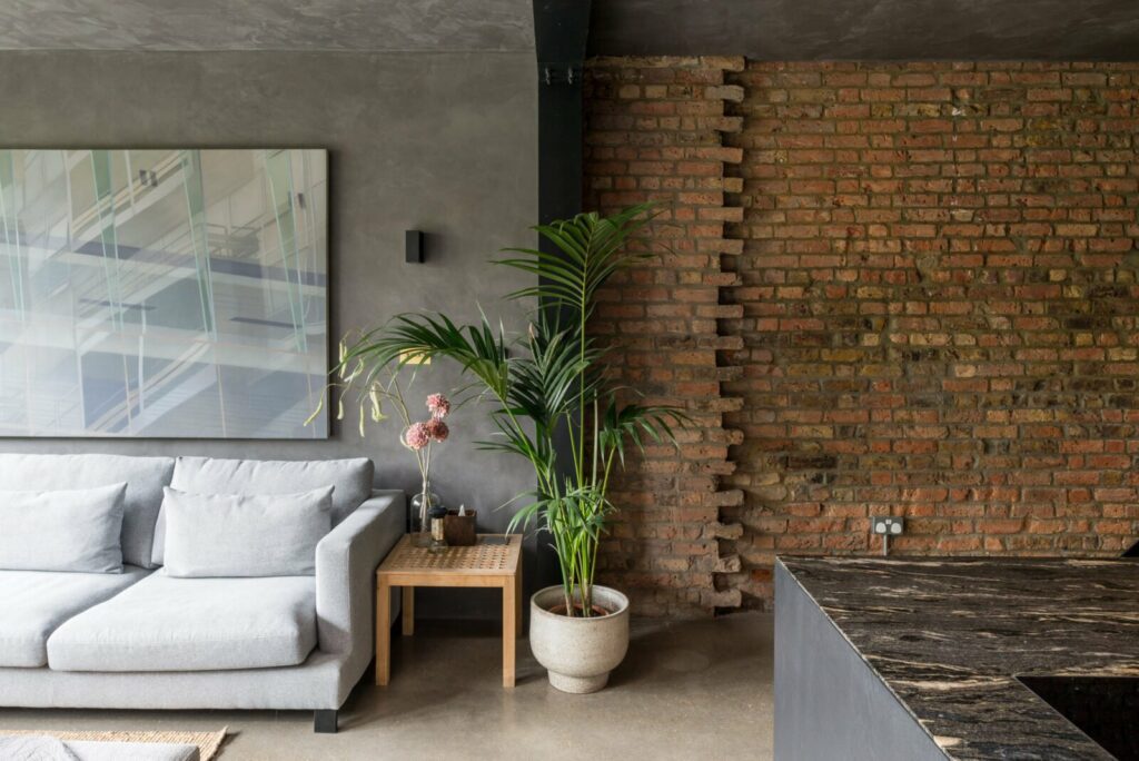 concrete finish walls with brick accent